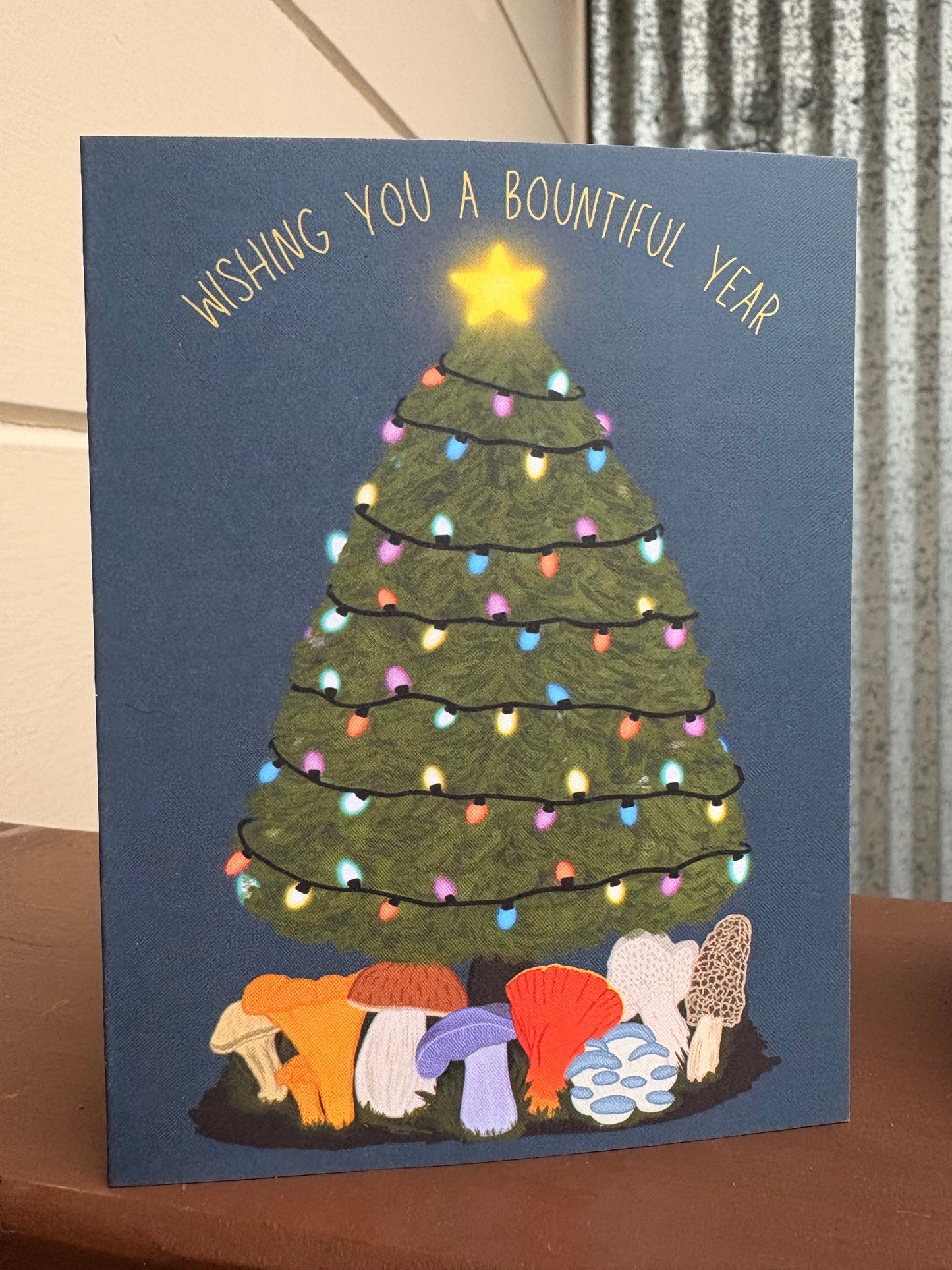 Wishing you a Bountiful Year Card with Edible Mushrooms Under the Christmas Tree